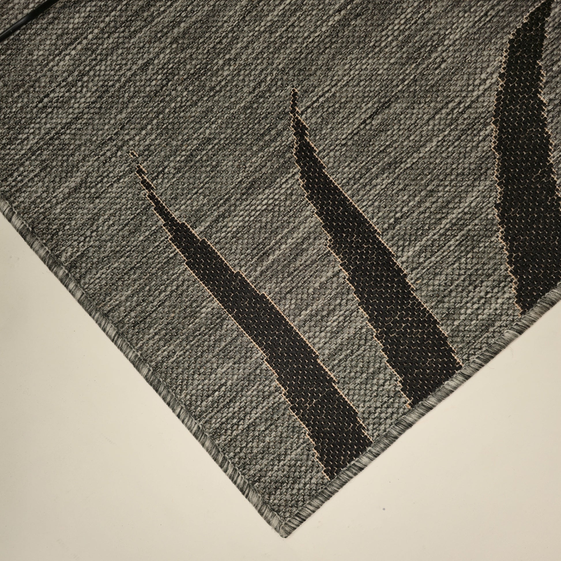 sileäksi kudottu matto lehti kulma