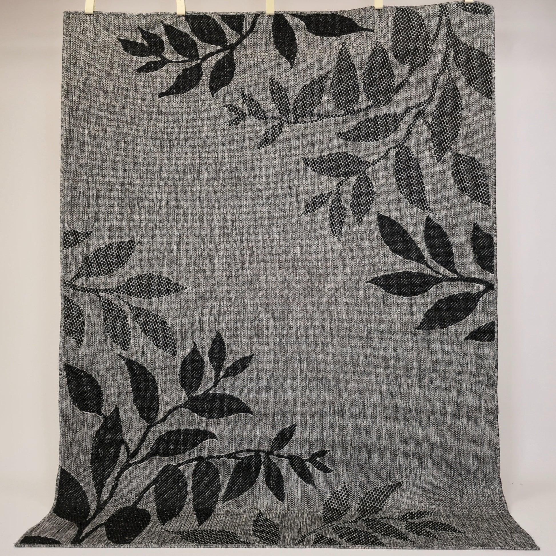 sileaksi kudottu matto leppä harmaa pääkuva